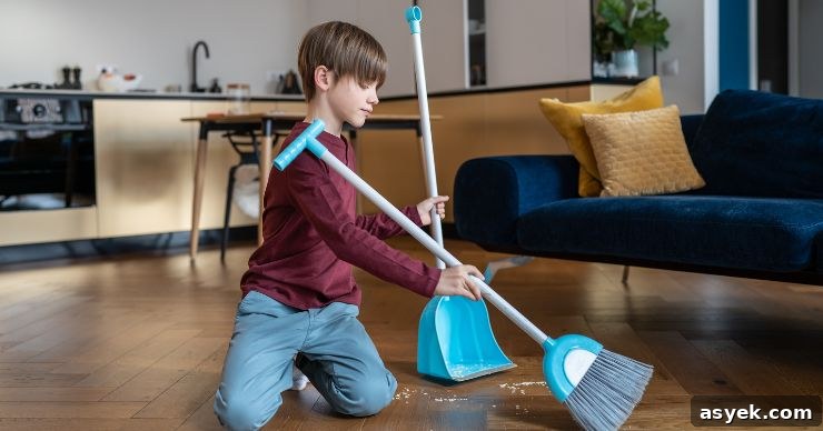 boy sweeping floor