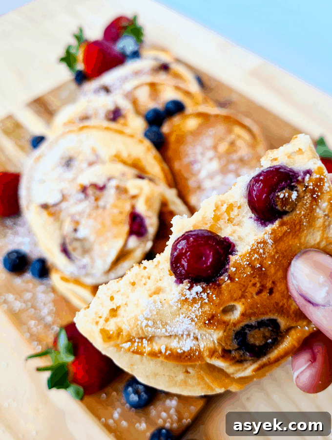 Close up of blueberry pancake torn in half