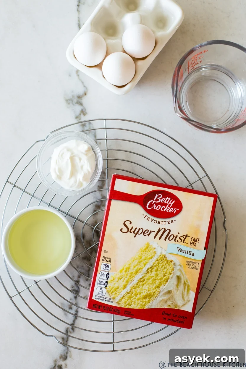 Classic Pecan Pie Bundt Cake Recipe 4 Overhead photo of ingredients for a bundt cake on a white marble background