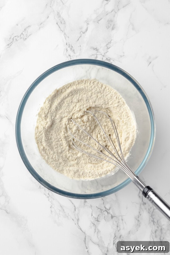 Dry ingredients in mixing bowl with whisk