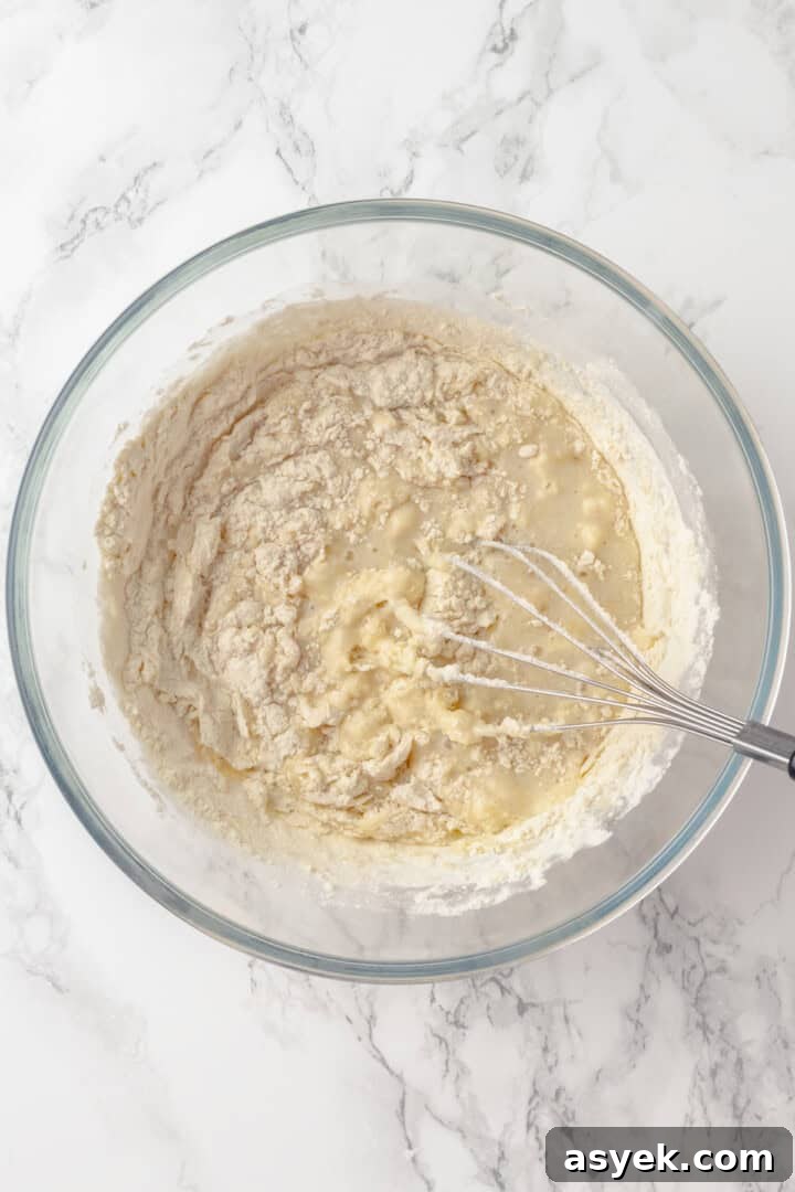 Whisking dry ingredients into wet ingredients