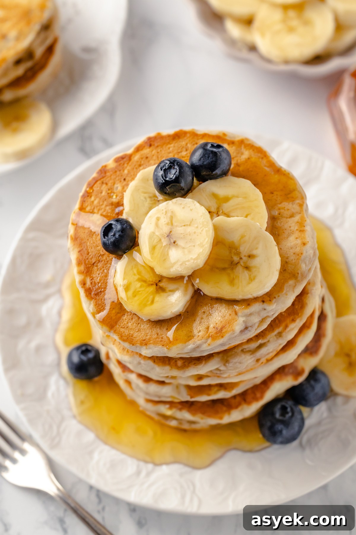 Top-down view of banana pancakes on plate