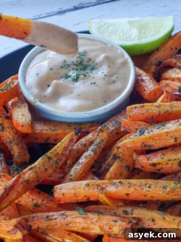 carrot fry being dipped into dip