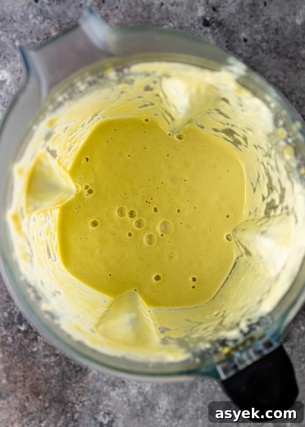 overhead image: creamy yellow sauce inside blender