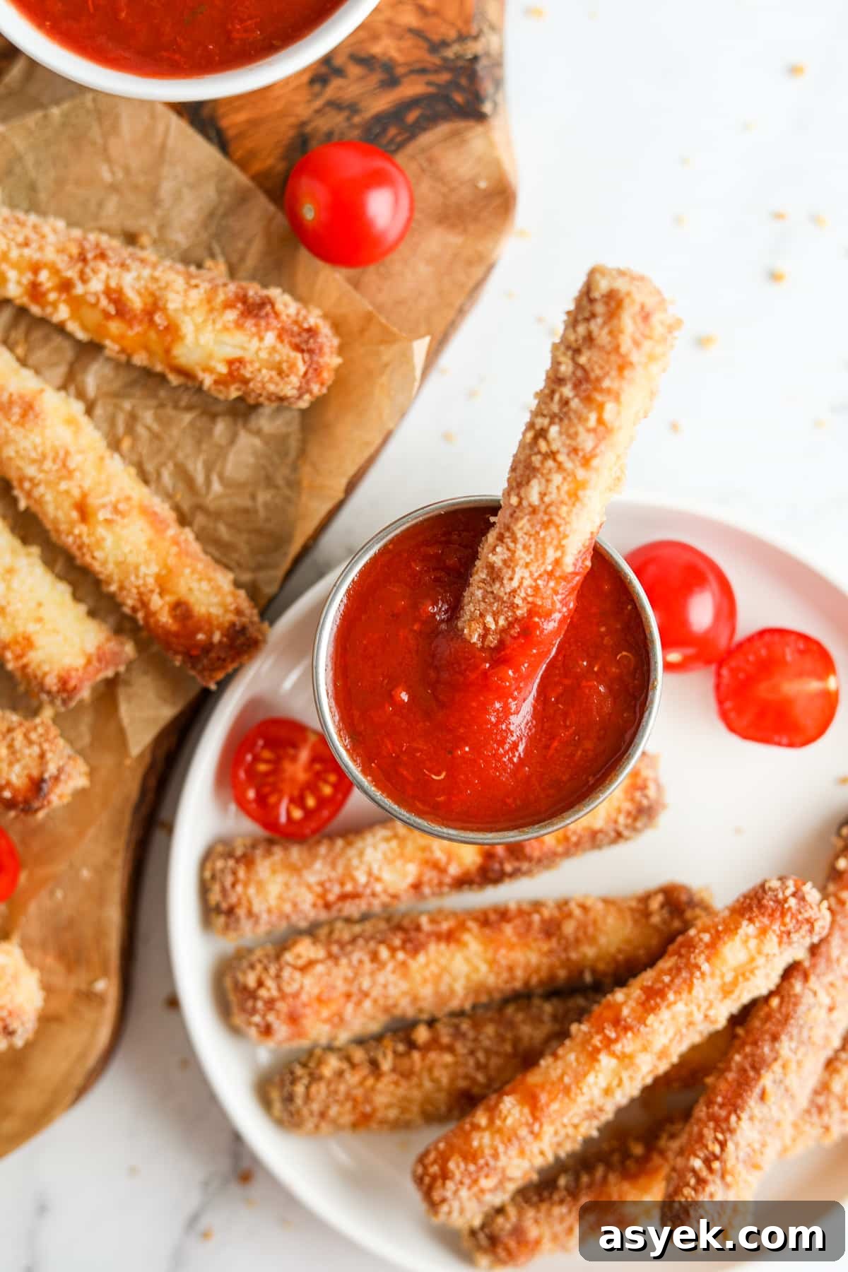 Crispy Air Fryer Halloumi Fries 8 Dipping an air fried cheese fry in pizza sauce.