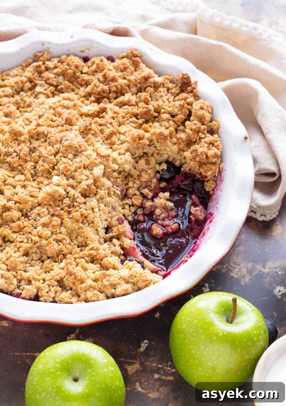 Classic Apple and Blueberry Crumble Recipe 2 Apple and blueberry crumble in a pie dish.