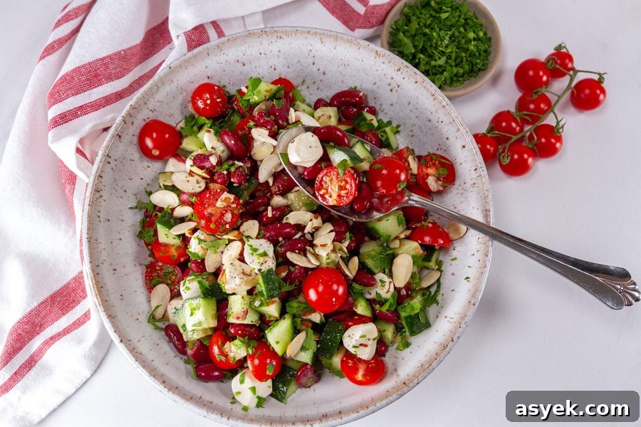 Zesty Kidney Bean Salad with Lemon and Fresh Herbs 8 Large bowl of kidney bean salad with a serving spoon and chopped parsley
