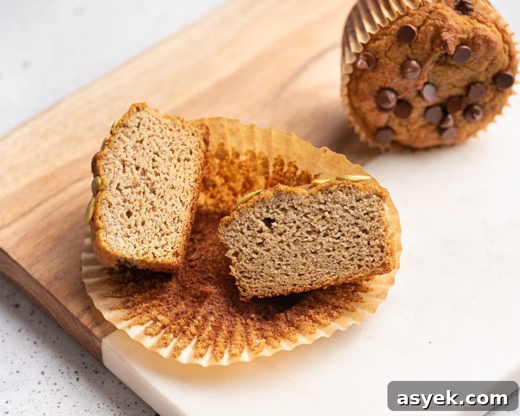 High-Protein Almond Flour Banana Muffins: Gluten-Free Snacks 8 sliced in half almond flour muffin on a paper liner