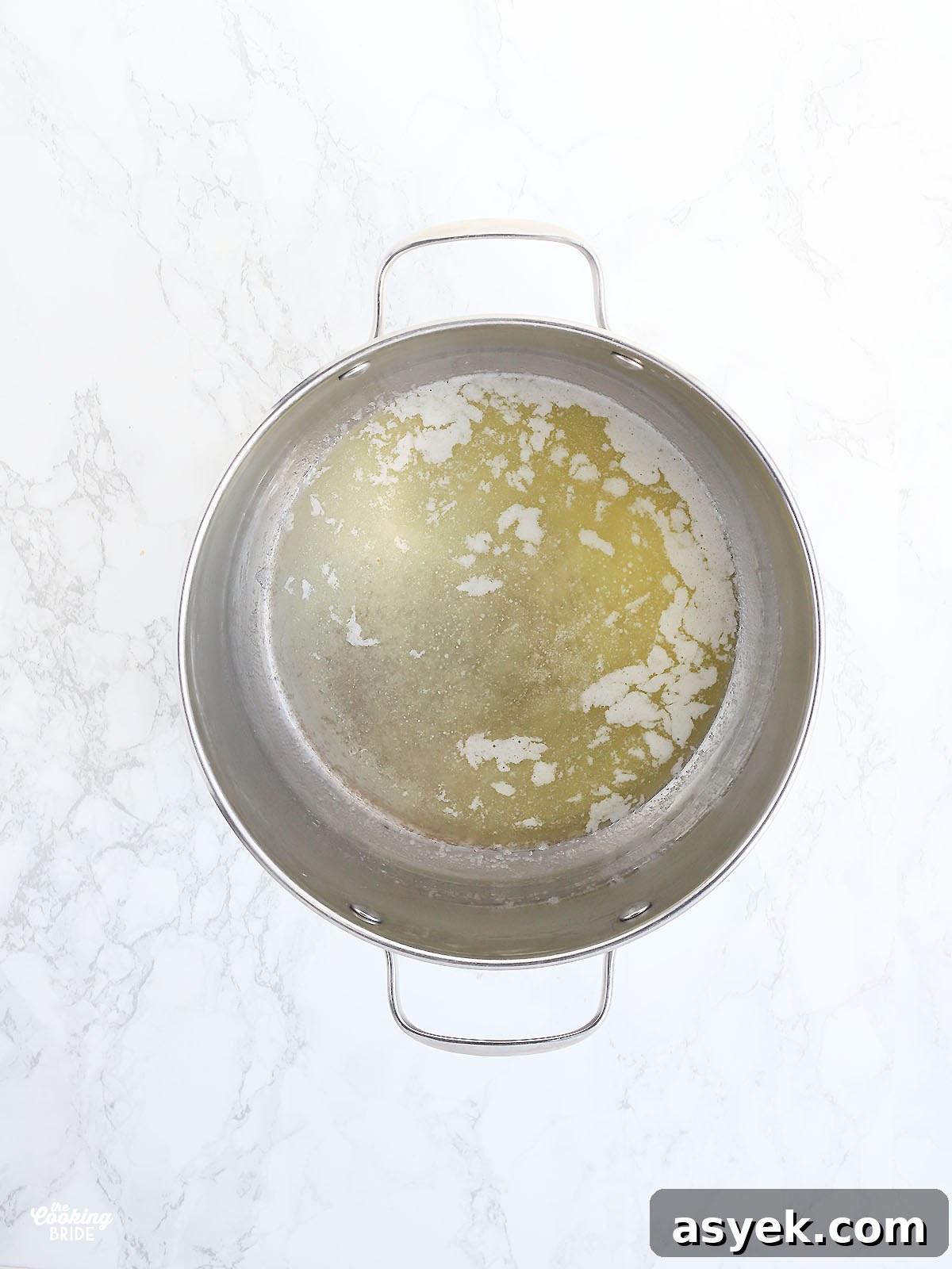 melted butter in a stainless steel stock pot