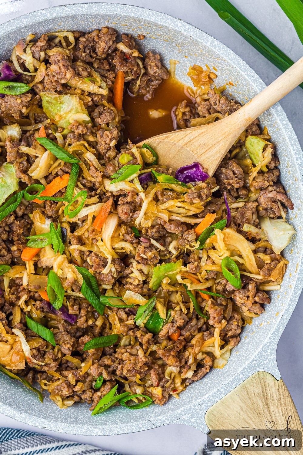 Egg Roll in a Bowl is a delicious deconstructed take on traditional egg rolls, featuring hearty ground sausage stir-fried with vegetables.