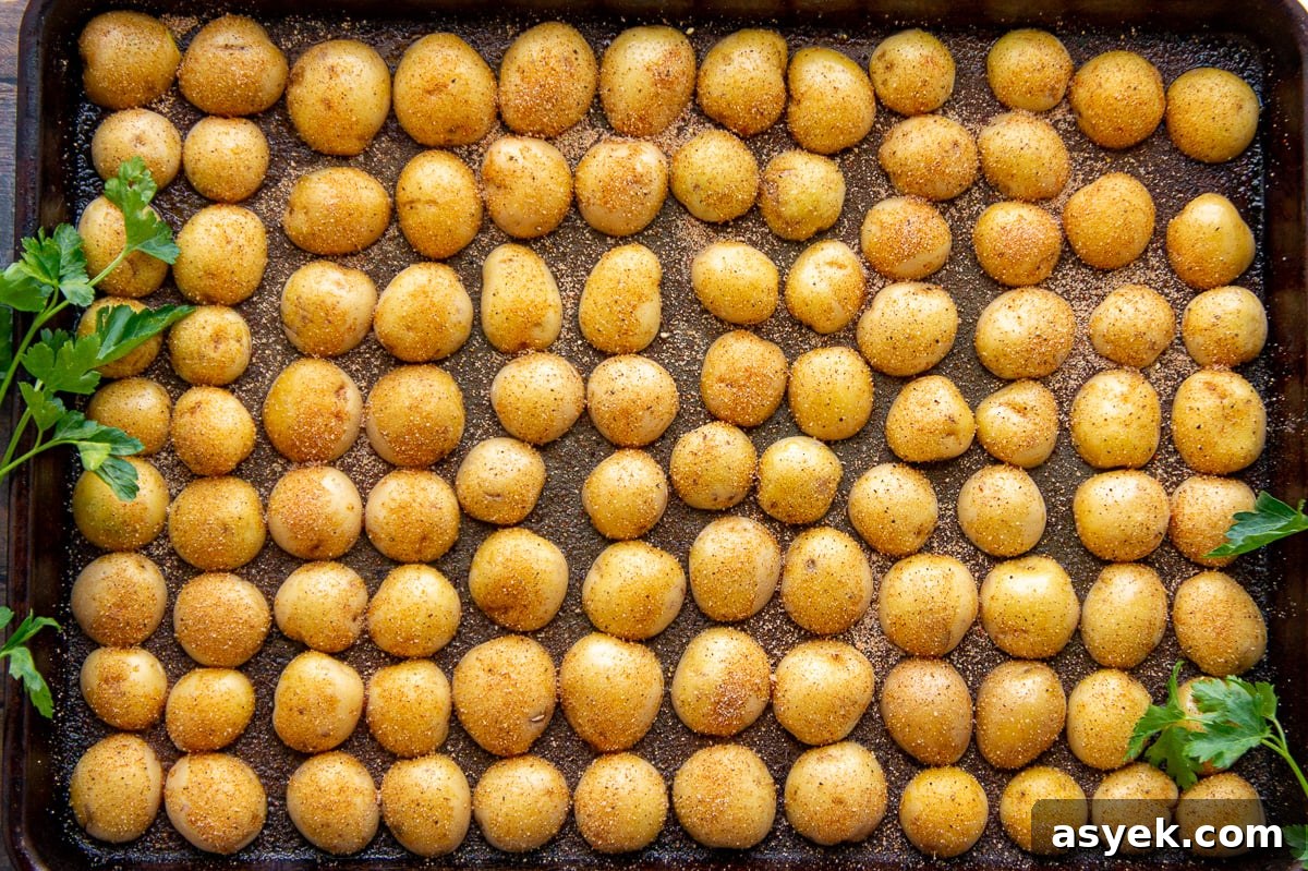 baby potatoes cut in half and arrange cut side down on a baking sheet.