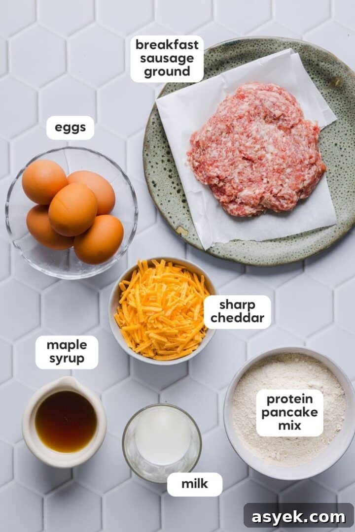 Ingredients for protein mcgriddle muffins displayed in small bowls on a white tile counter.