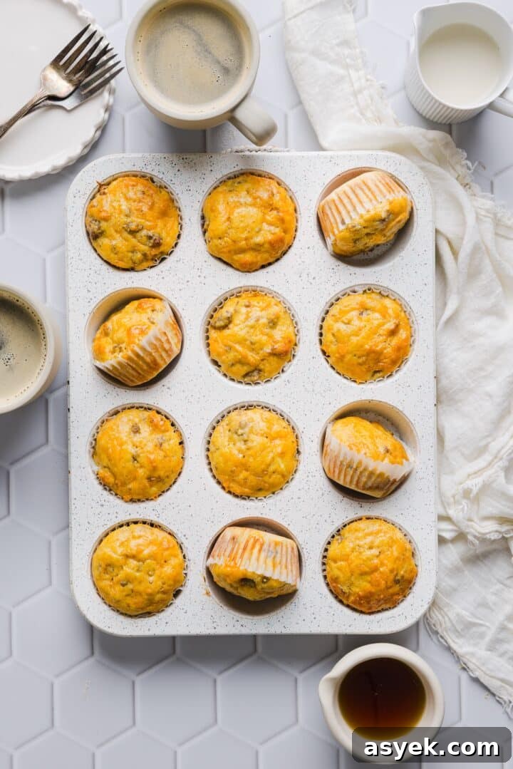 Protein mcgriddle muffins in a grey muffin pan on a white tile counter top.
