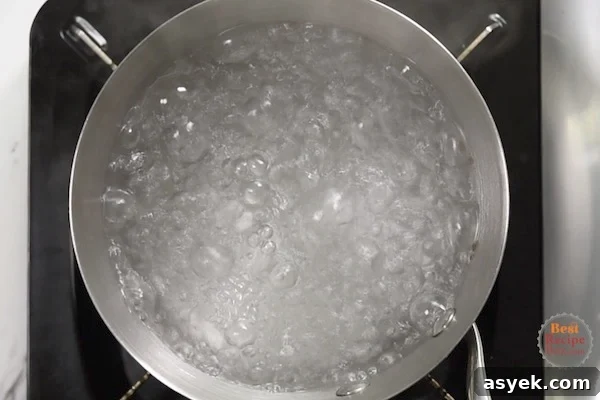How to Peel Hard-Boiled Eggs Perfectly Every Time 3 Boiling water in a pan