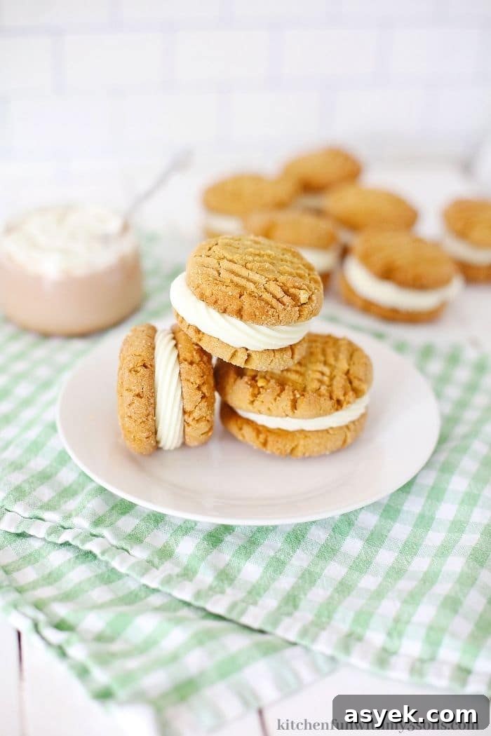 Classic Peanut Butter Sandwich Cookies with Creamy Filling 2 Cookies stacked on each other on a plate.