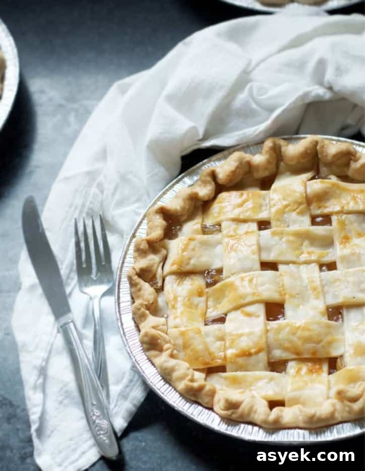 An overhead view of a pie with a fork and knife - How to Make Apple Pie with Apple Pie Filling