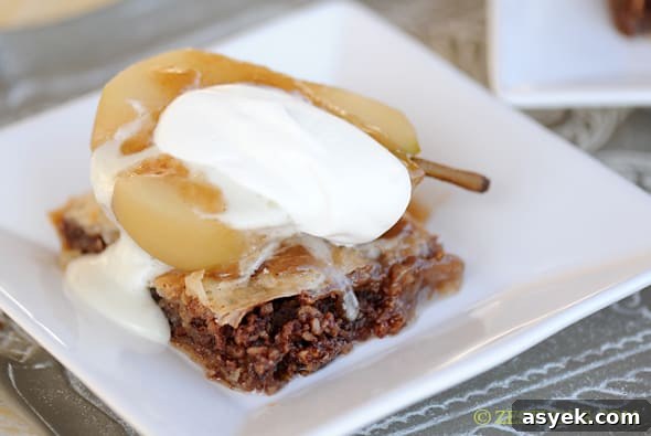 riesling poached pear with blue cheese fondant on top of baklava