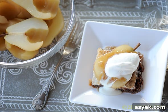 riesling poached pears on a plate with baklava and blue cheese fondant