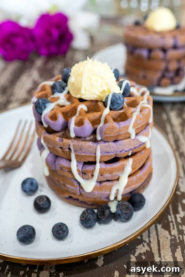 stack of ube waffles with butter.