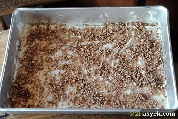 crushed pecans on top of buttered phyllo dough