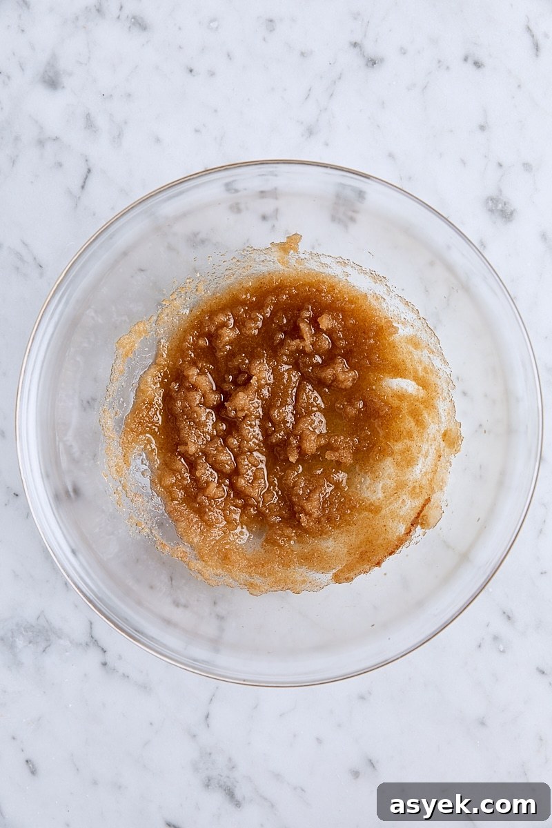 Small Batch Oatmeal Chocolate Chip Cookies Recipe 7 Brown butter and sugars whisked together in glass bowl