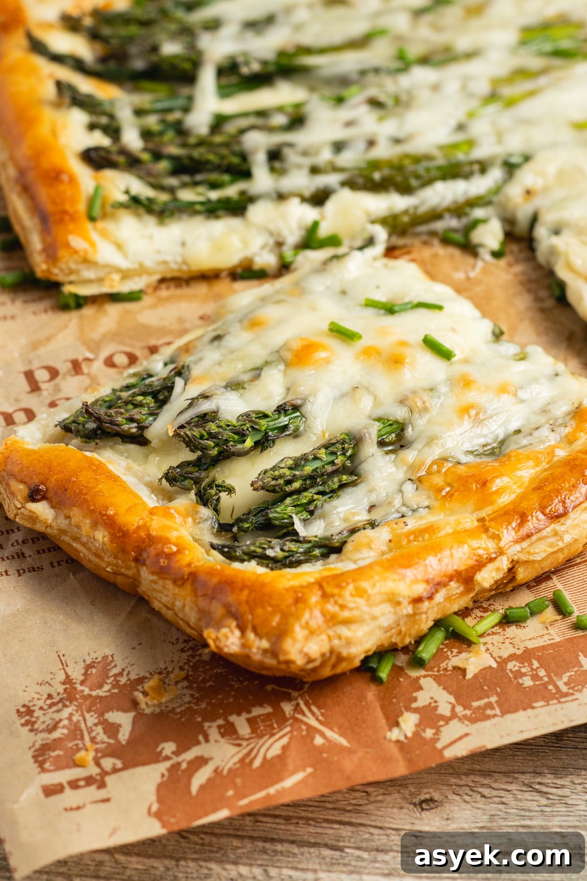 Asparagus and Boursin Puff Pastry Tart Recipe 2 This is a picture of a slice of asparagus puff pastry tart with Boursin.