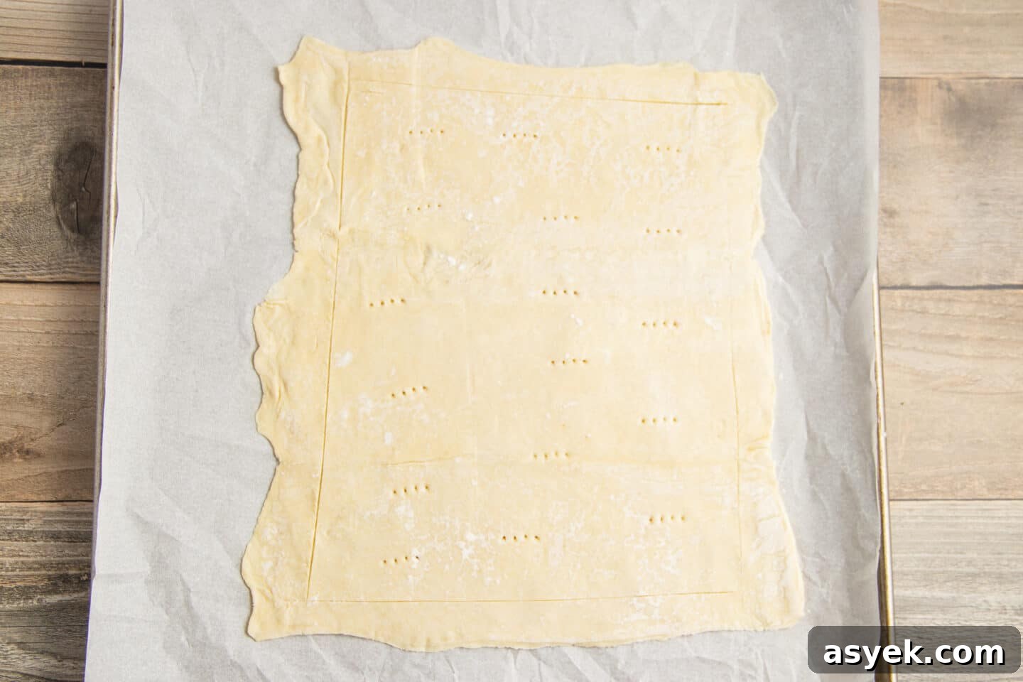 Asparagus and Boursin Puff Pastry Tart Recipe 4 This is a picture of a puff pastry rolled on a baking sheet.