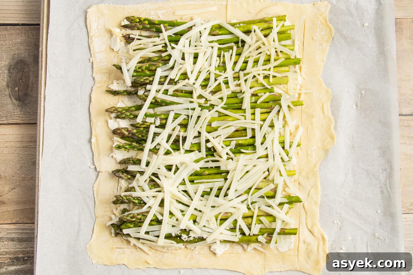 Asparagus and Boursin Puff Pastry Tart Recipe 9 This is a picture of the puff pastry with asparagus and cheese added.