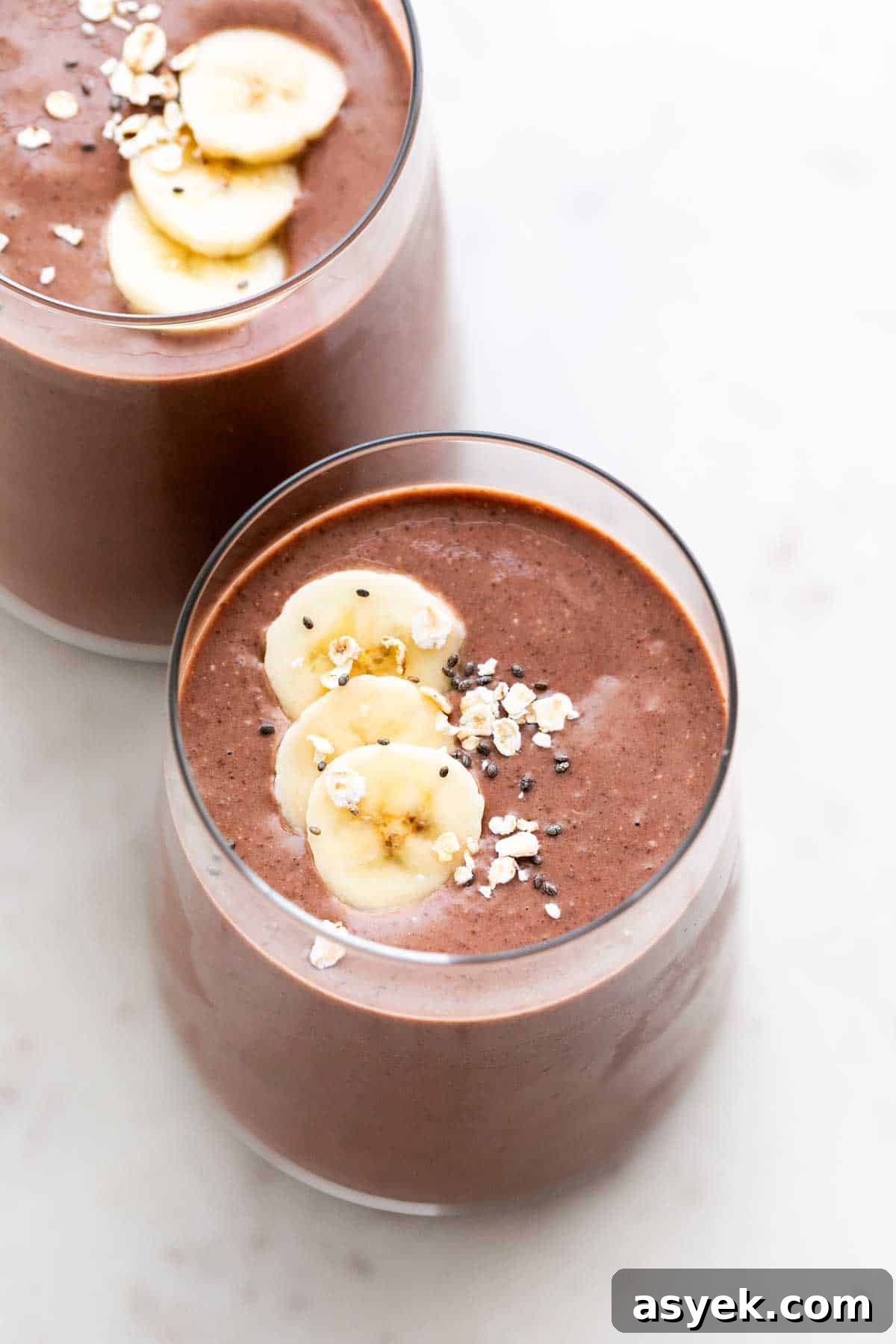 Two glasses brimming with vegan protein shake.