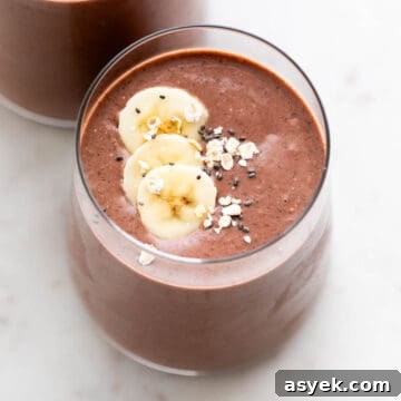 Two glasses holding dairy-free protein shake.