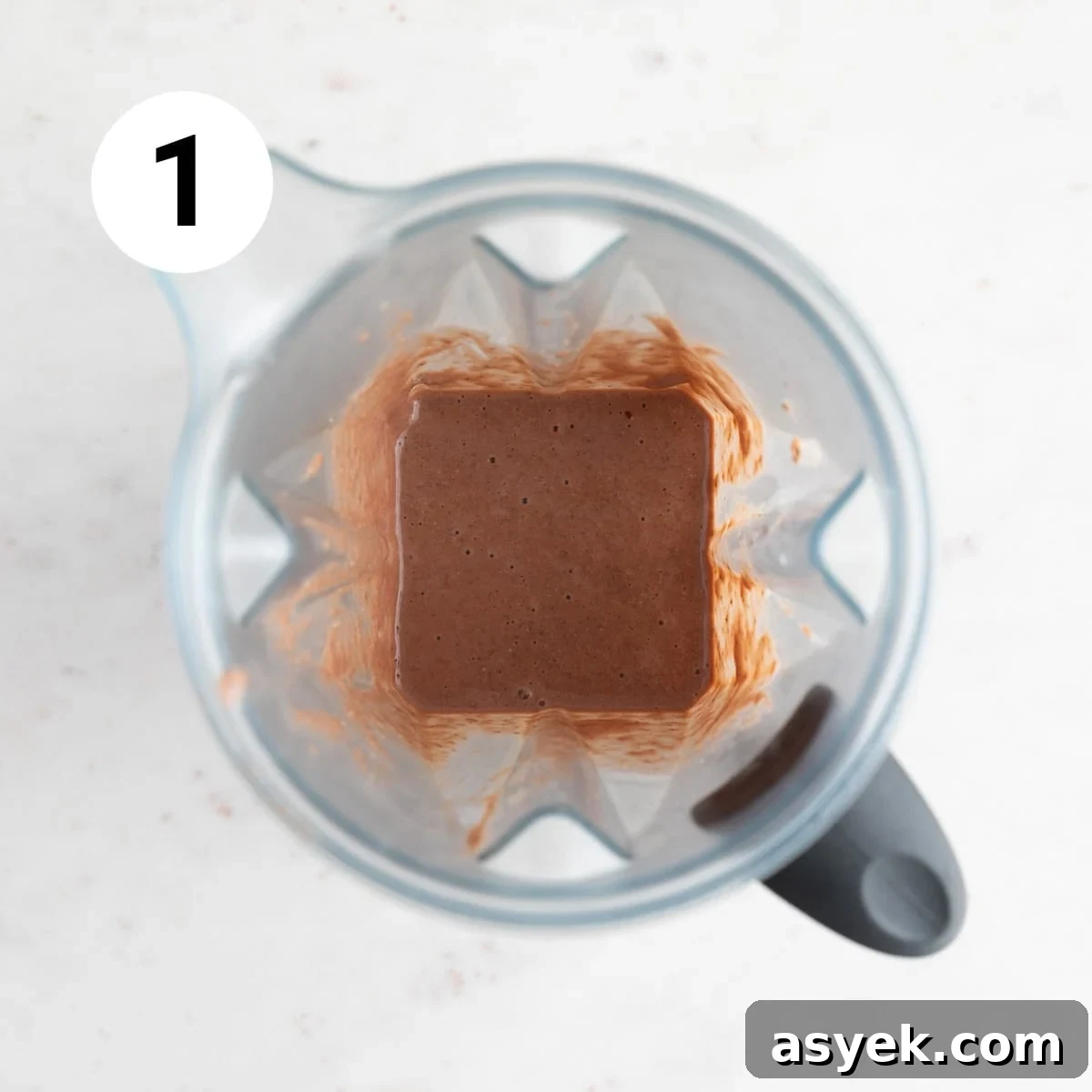 Blender mug with vegan protein shake.