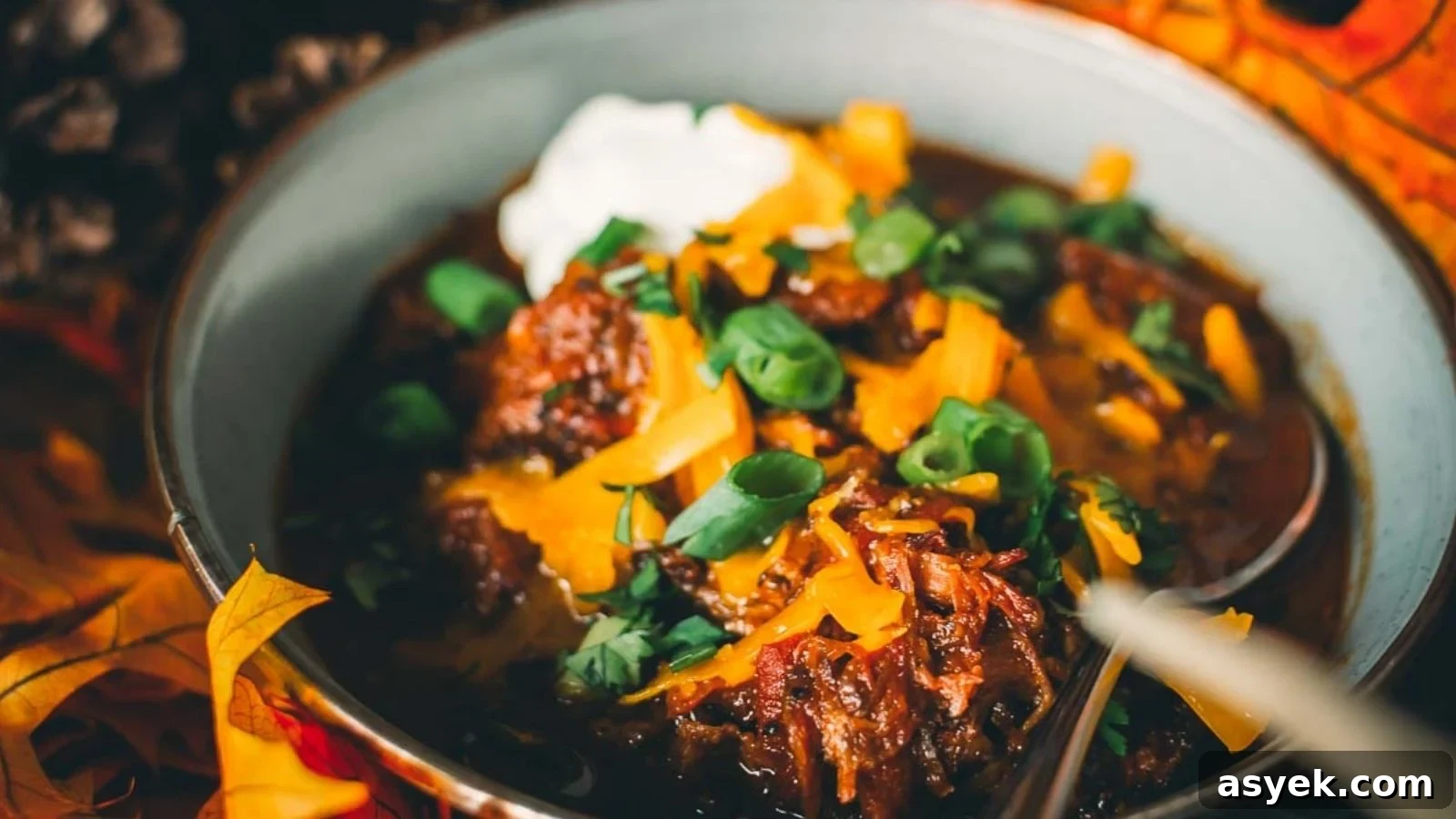 Smoked beef shank over-the-top chili with smoky shredded beef throughout the pot.