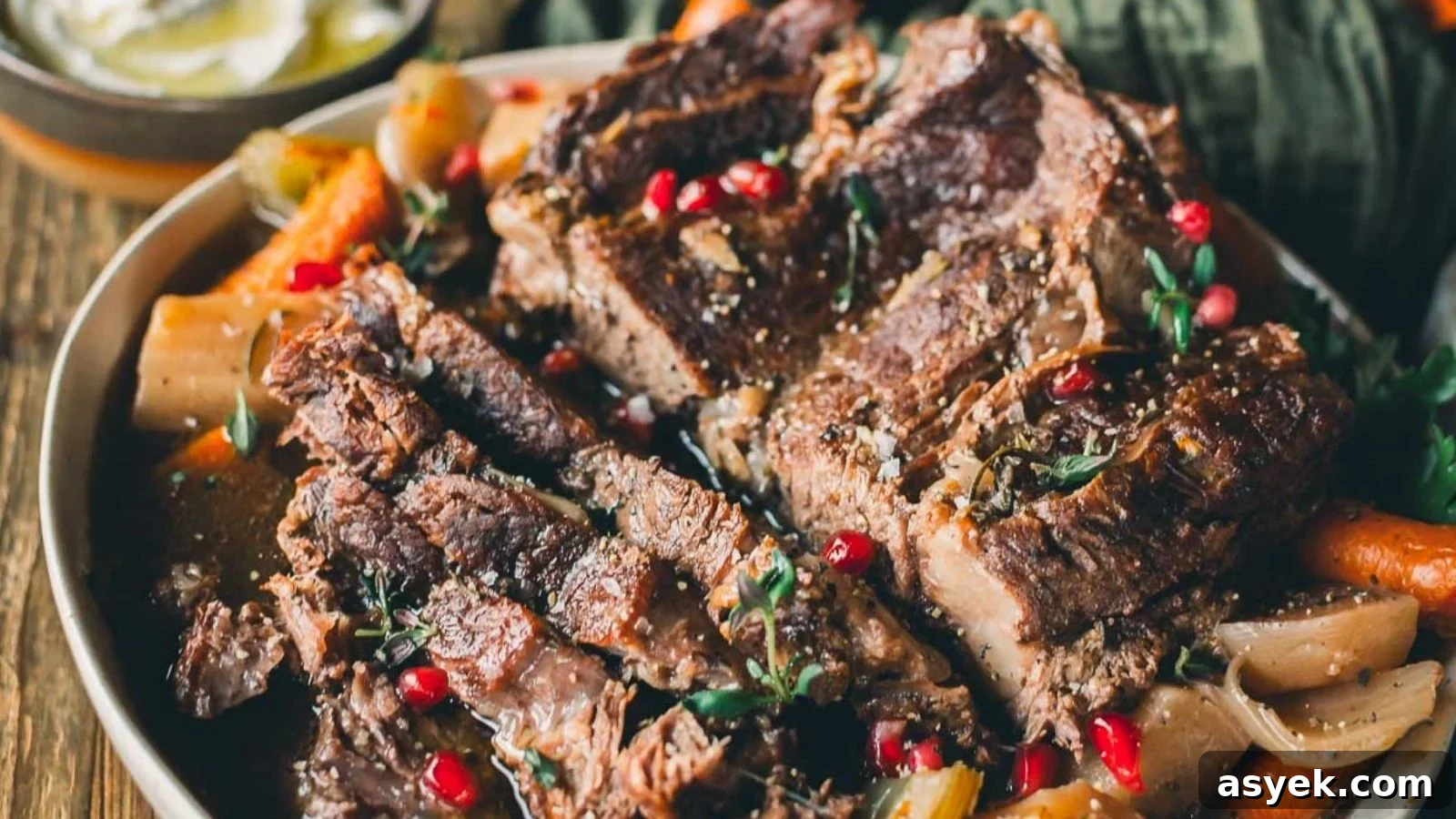 Instant Pot pot roast with tender shredded beef, potatoes, and carrots in rich gravy.