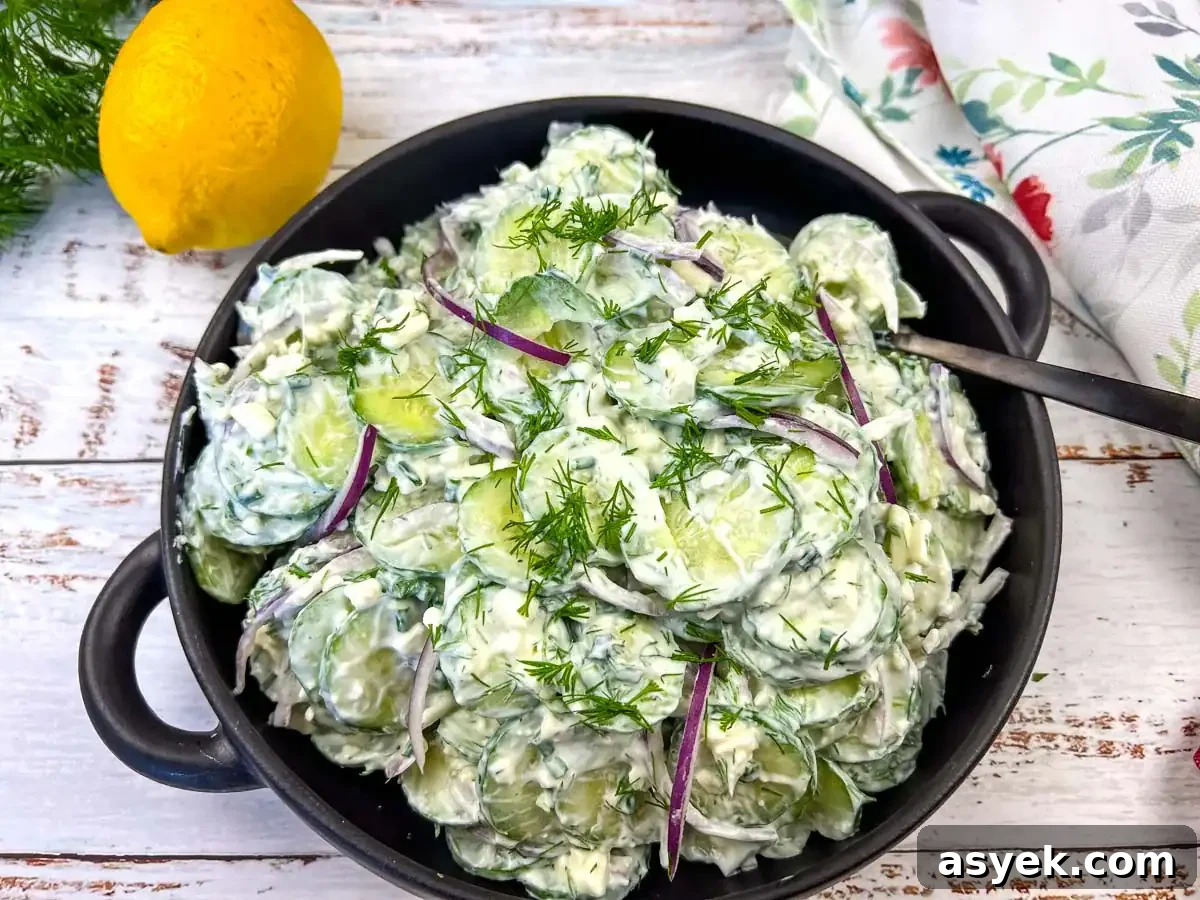 Cucumber and Feta salad in a black bowl.