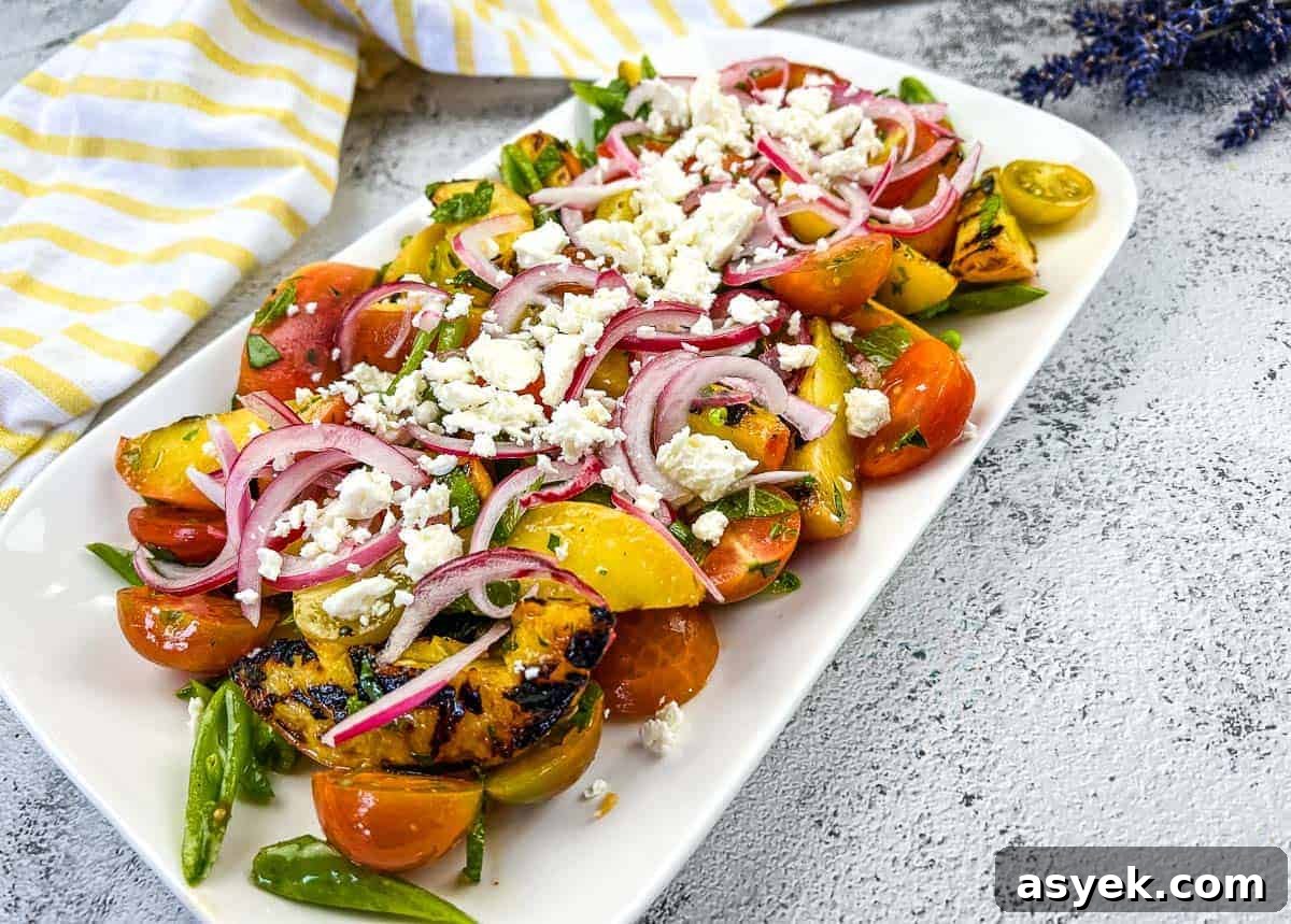 A plate with Grilled Peach Salad with Tomatoes.
