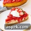 25+ Dairy-Free, Gluten-Free Protein Desserts 26 Protein cheesecake topped with strawberries on a white plate.