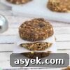 25+ Dairy-Free, Gluten-Free Protein Desserts 4 Three no bake protein cookies stacked with parchment paper between them.