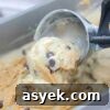 25+ Dairy-Free, Gluten-Free Protein Desserts 31 Close up of an ice cream scoop scooping peanut butter chocolate chip ice cream.