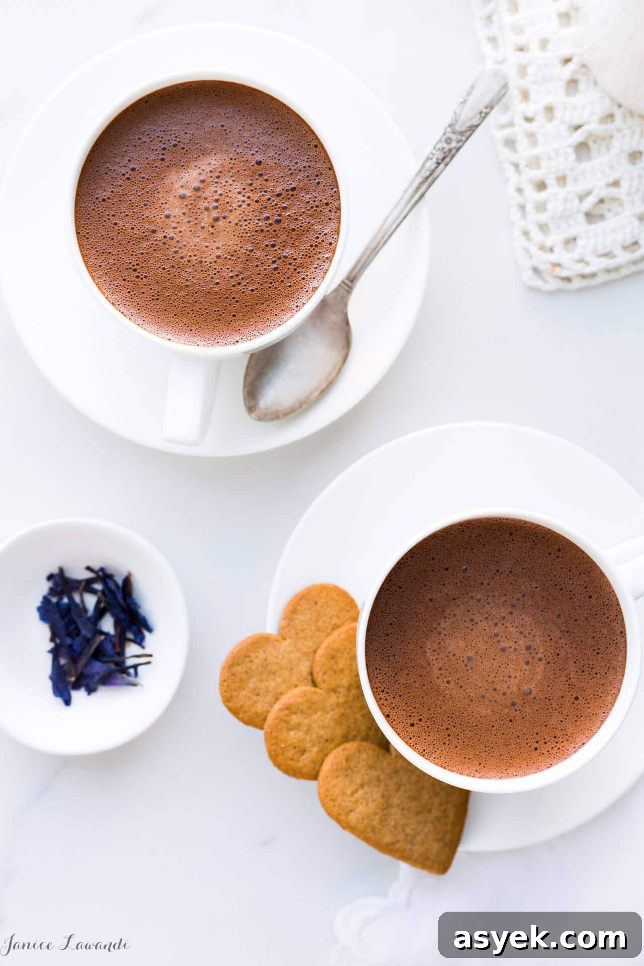 How to Make Earl Grey Hot Chocolate 6 Overhead shot of two cups of homemade hot chocolate made with just 2 ingredients: chocolate and milk, and served with heart-shaped cookies.